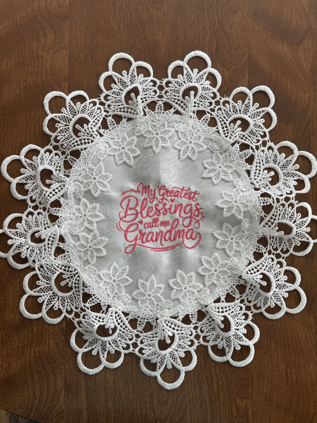 'My Greatest Blessings Call Me Grandma' machine embroidered 16" white doily